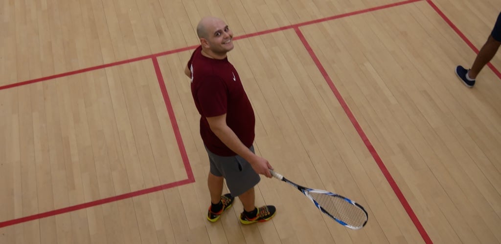 Roland Gallard the coach on the squash court